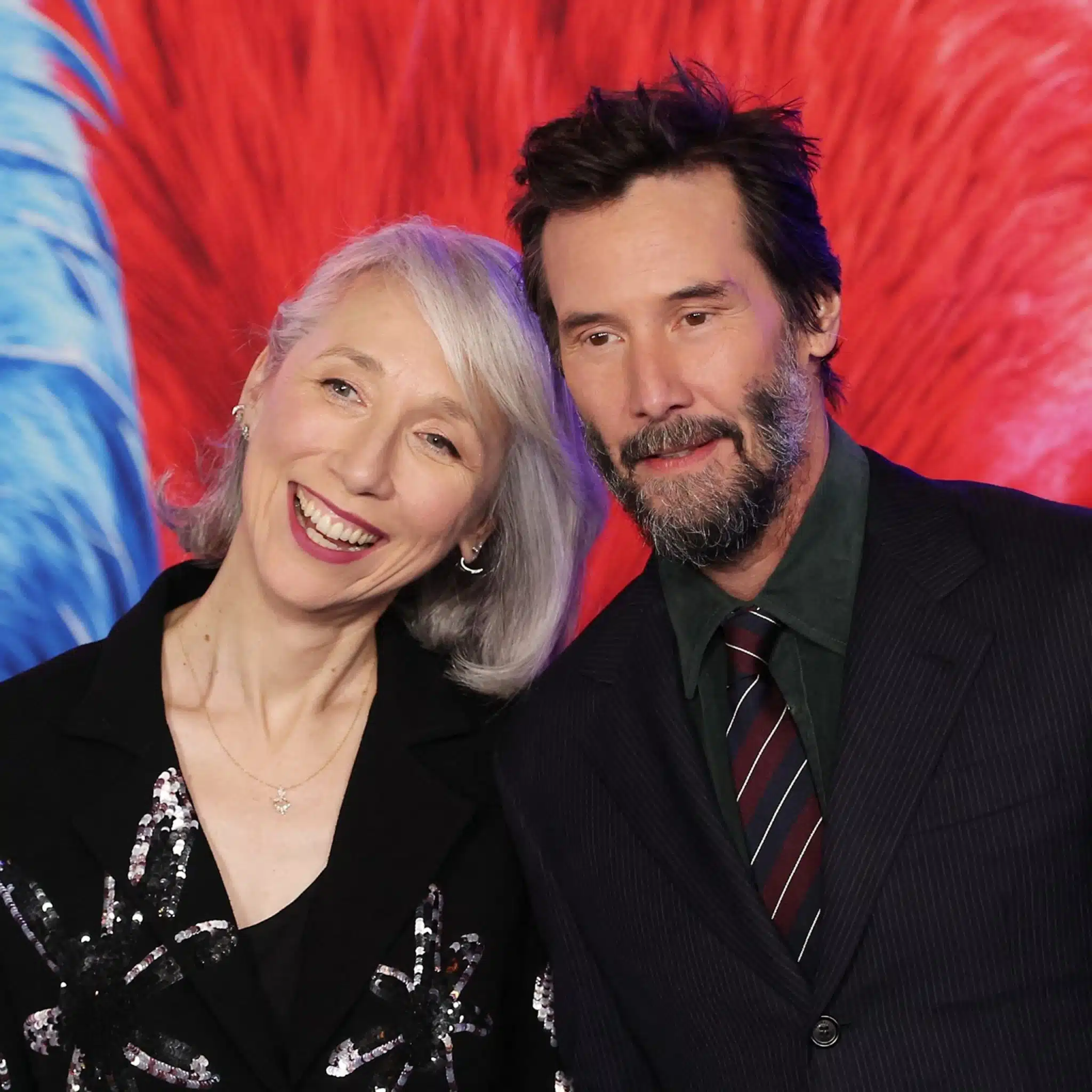 Le couple souriant et complice lors d'une soirée officielle