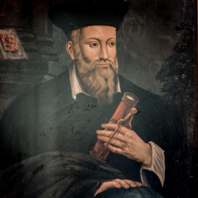 Vieille gravure ou portrait de Nostradamus, avec des symboles astrologiques en arri&egrave;re-plan